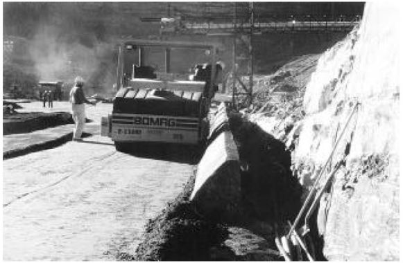 Compaction of RCC Adjacent to Slip-Formed Concrete Facing Element After Approximately 6 hours